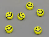 Мънисто жълто с усмивка d=6.8mm, дебелина 3.7mm, отвор 1.6mm - 50g ≈ 432 бр.